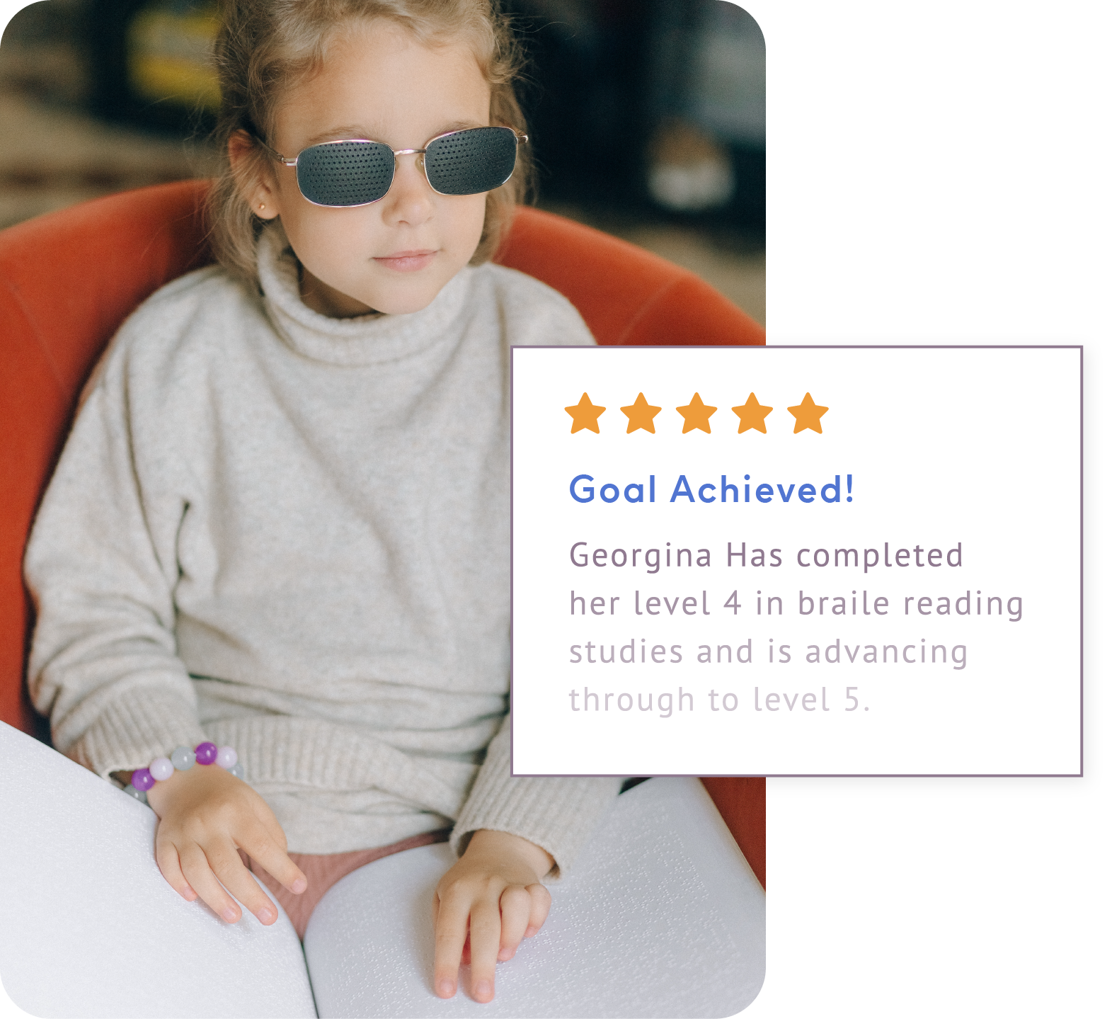 Young, blind girl with ShiftCare notification showing she has reached her goal in Level 4 Braille