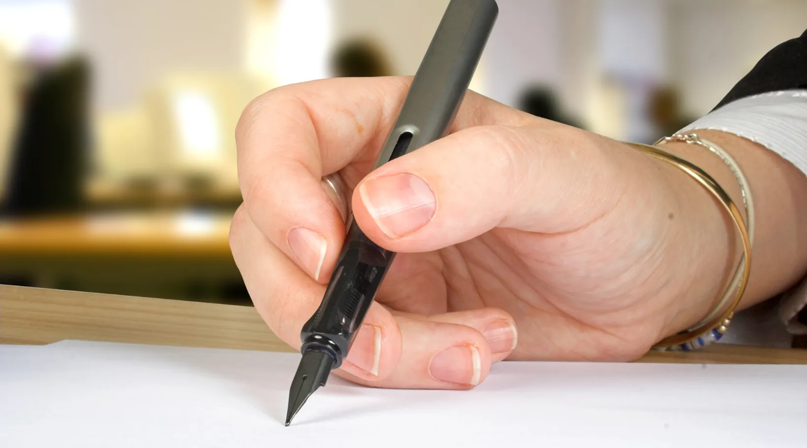 Care provider signing compliance forms, ensuring accurate documentation with ShiftCare.