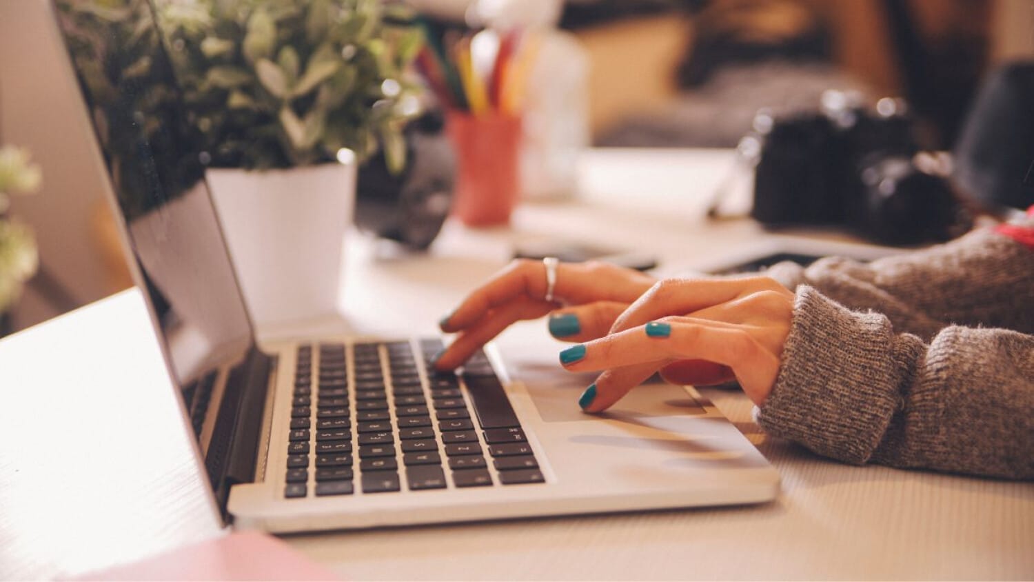 Support coordinator using ShiftCare platform to update client records from a home office workspace.