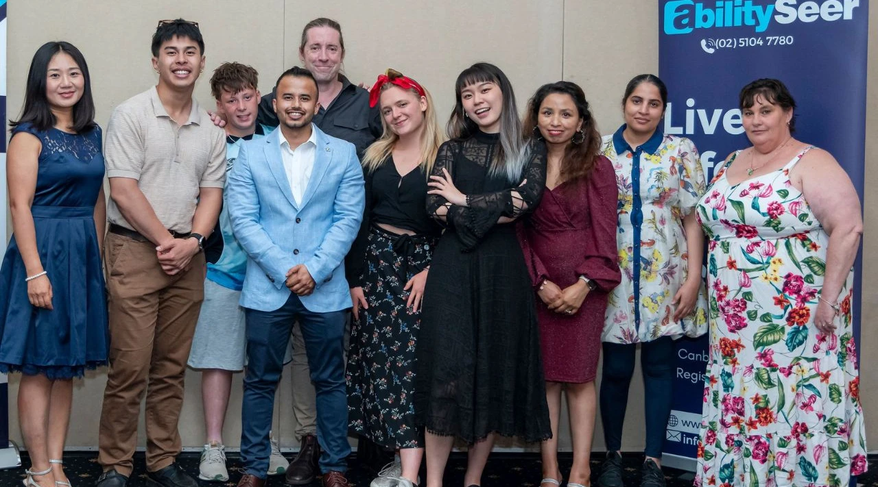 ShiftCare and AbilitySeer staff gather, blending cultures and personalities at a care celebration.