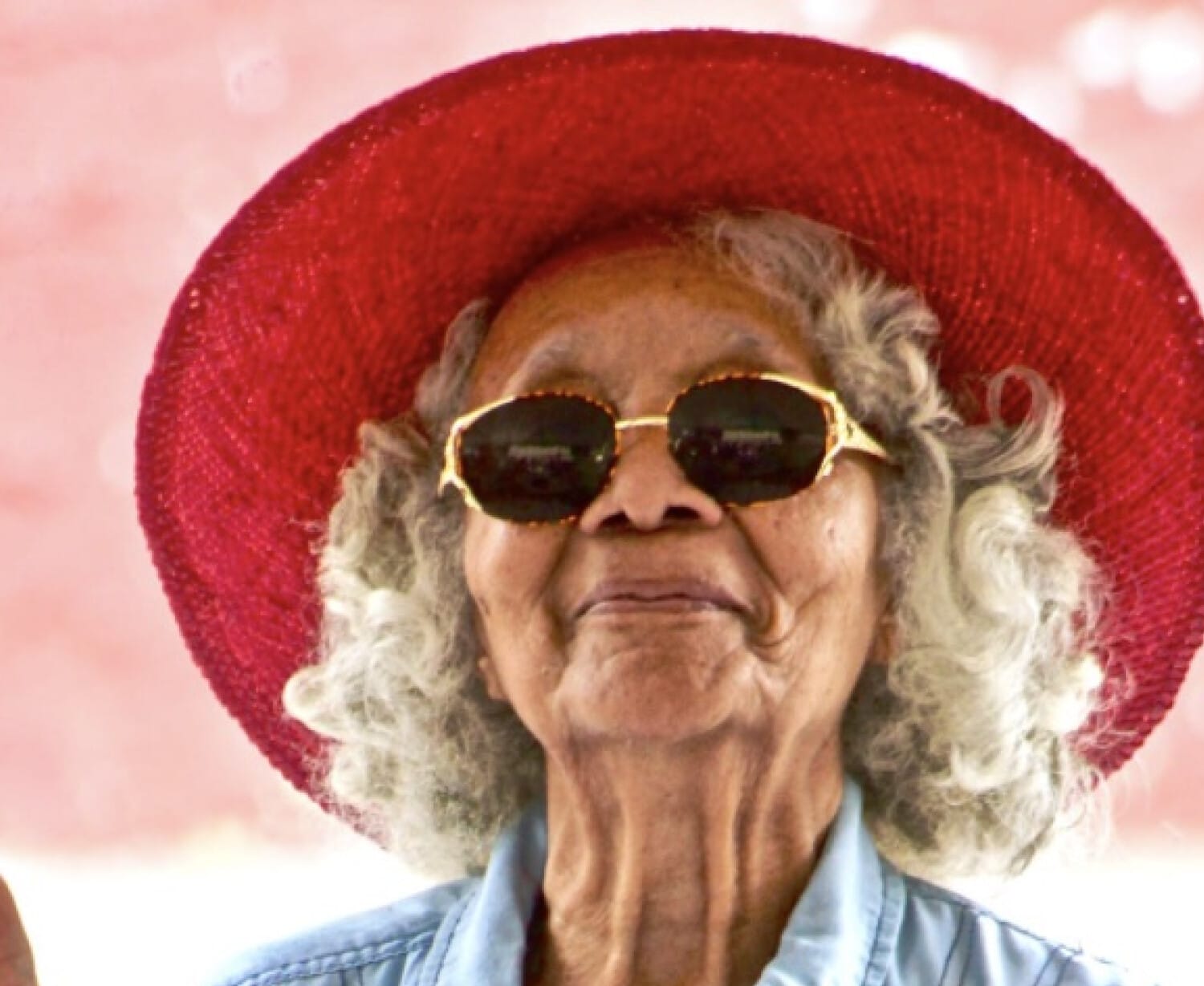 Older woman enjoying life outdoors, representing positive aging and wellbeing for seniors.