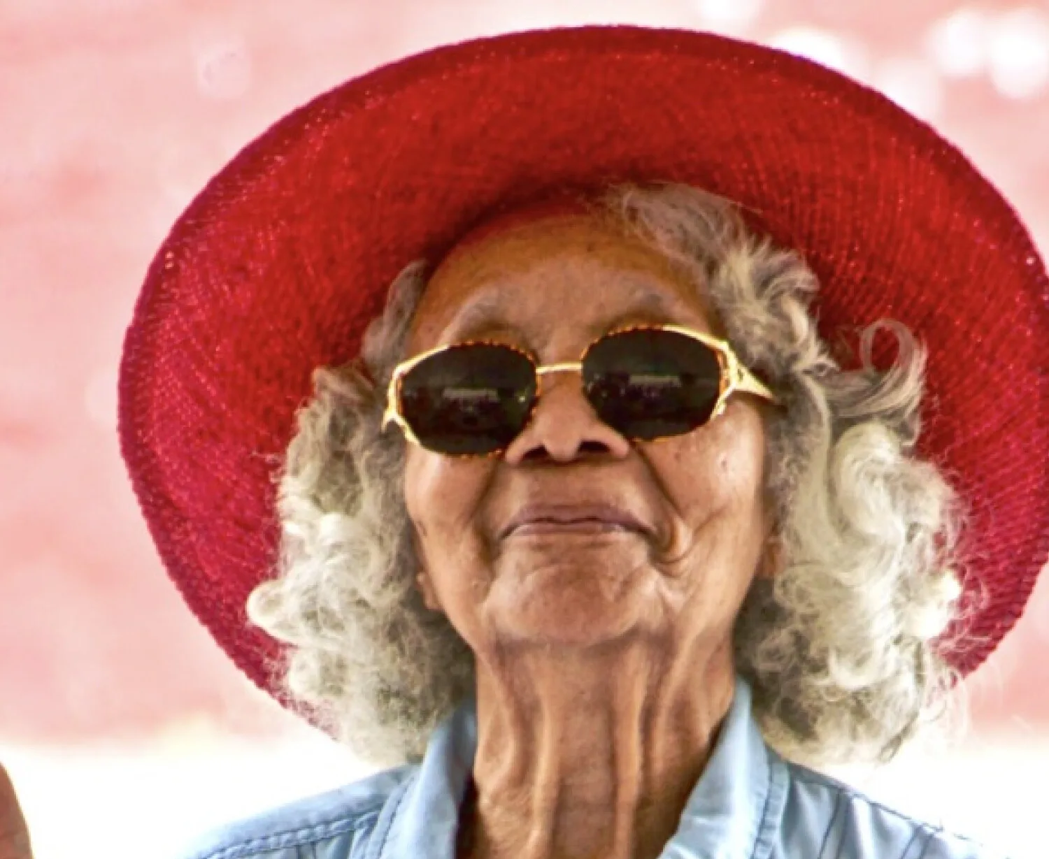 Older woman enjoying life outdoors, representing positive aging and wellbeing for seniors.