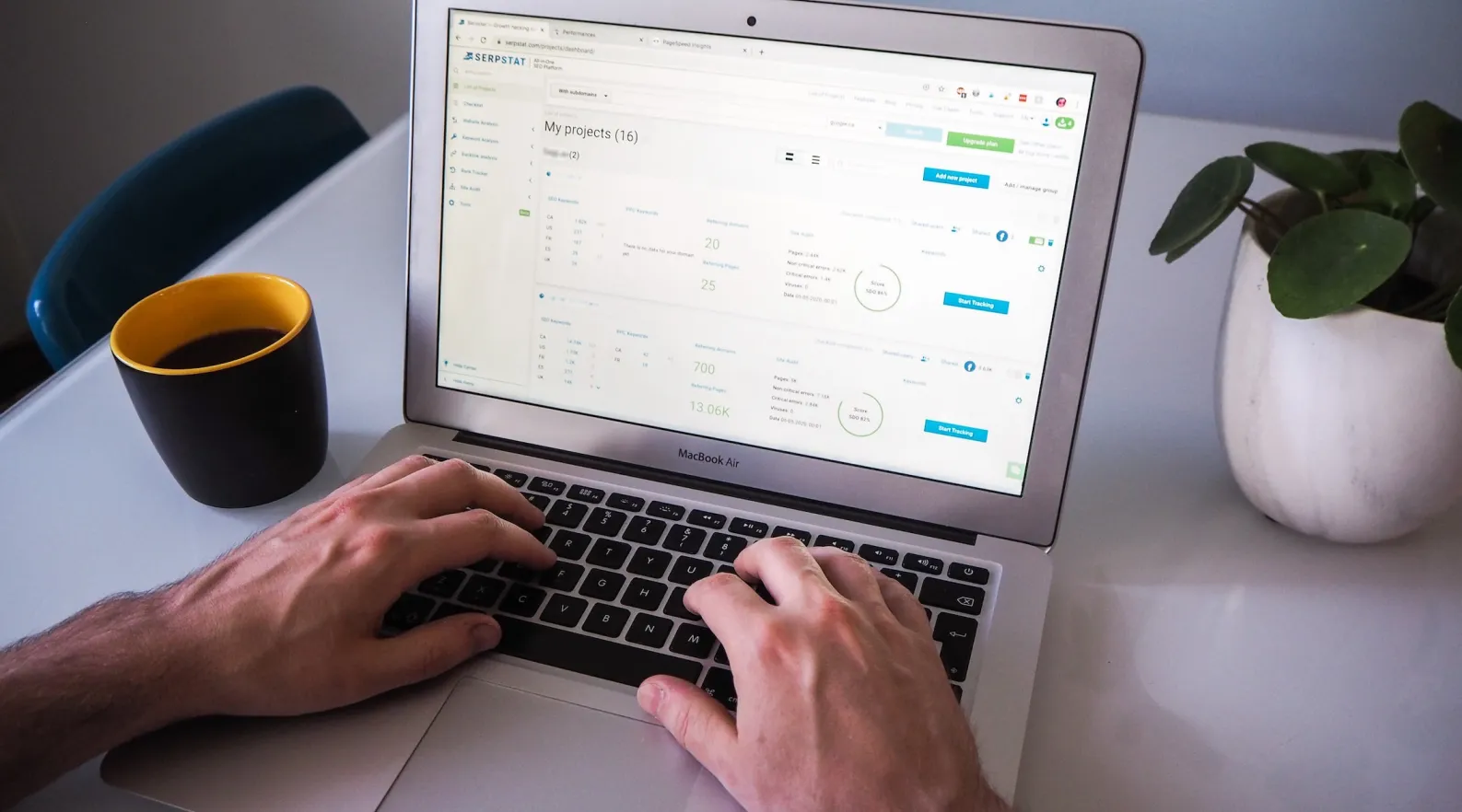 Care administrator using laptop dashboard to manage schedules and client care operation.