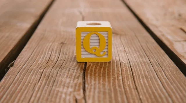 Yellow Q block symbolizing questions and answers for ShiftCare’s NDIS audit webinar.