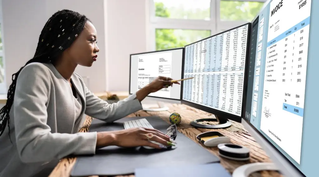 ShiftCare professional reviewing invoice reports and analytics.