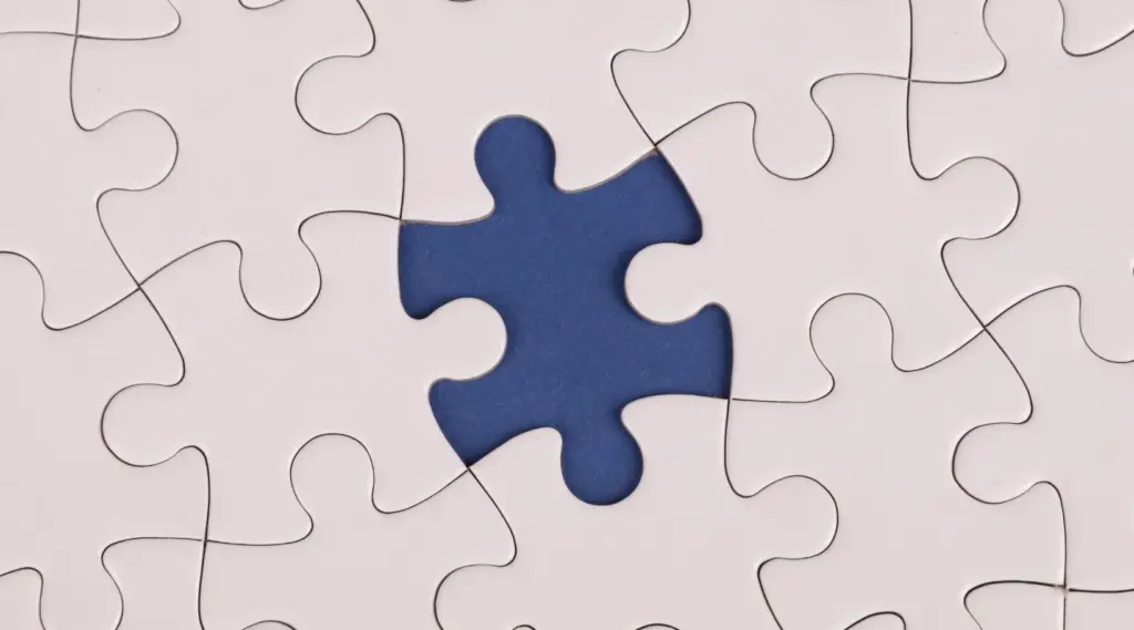 Missing puzzle piece symbolizing teamwork and problem-solving with ShiftCare.