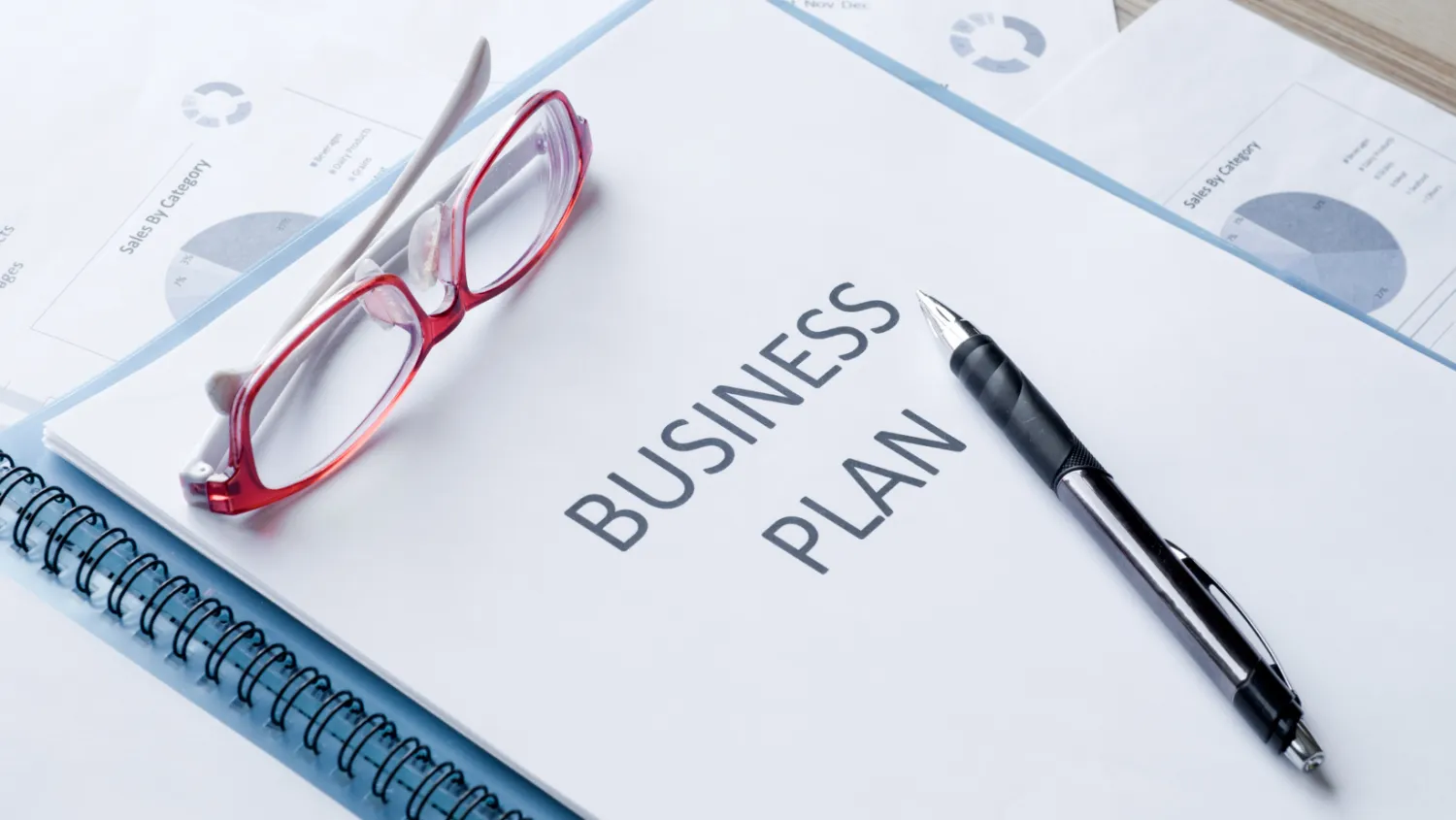 business-plan-doc-red-glasses-pen