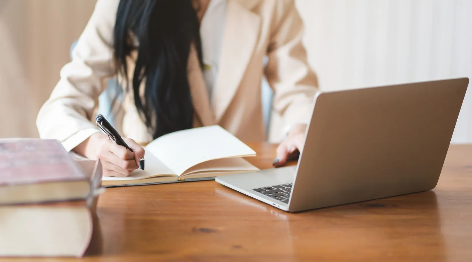 NDIS provider writing case notes while using ShiftCare software for compliance tracking.