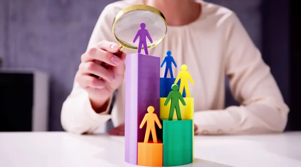ShiftCare concept showing customer growth with colorful human figures on ascending bars.