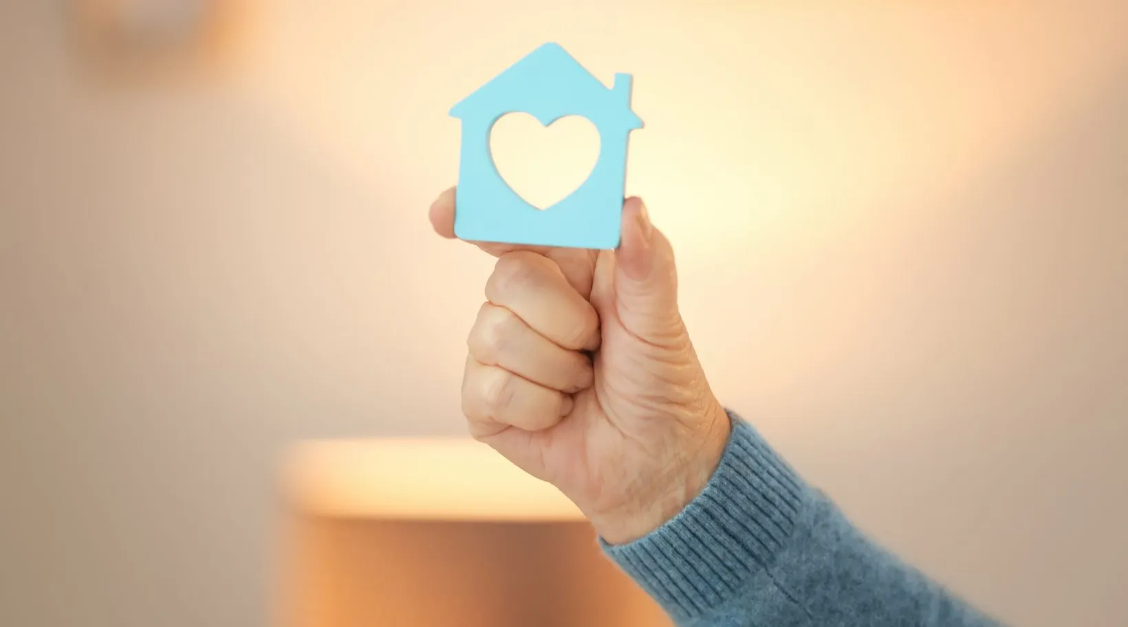 Heart-shaped home icon symbolizing care, safety, and support, ShiftCare.