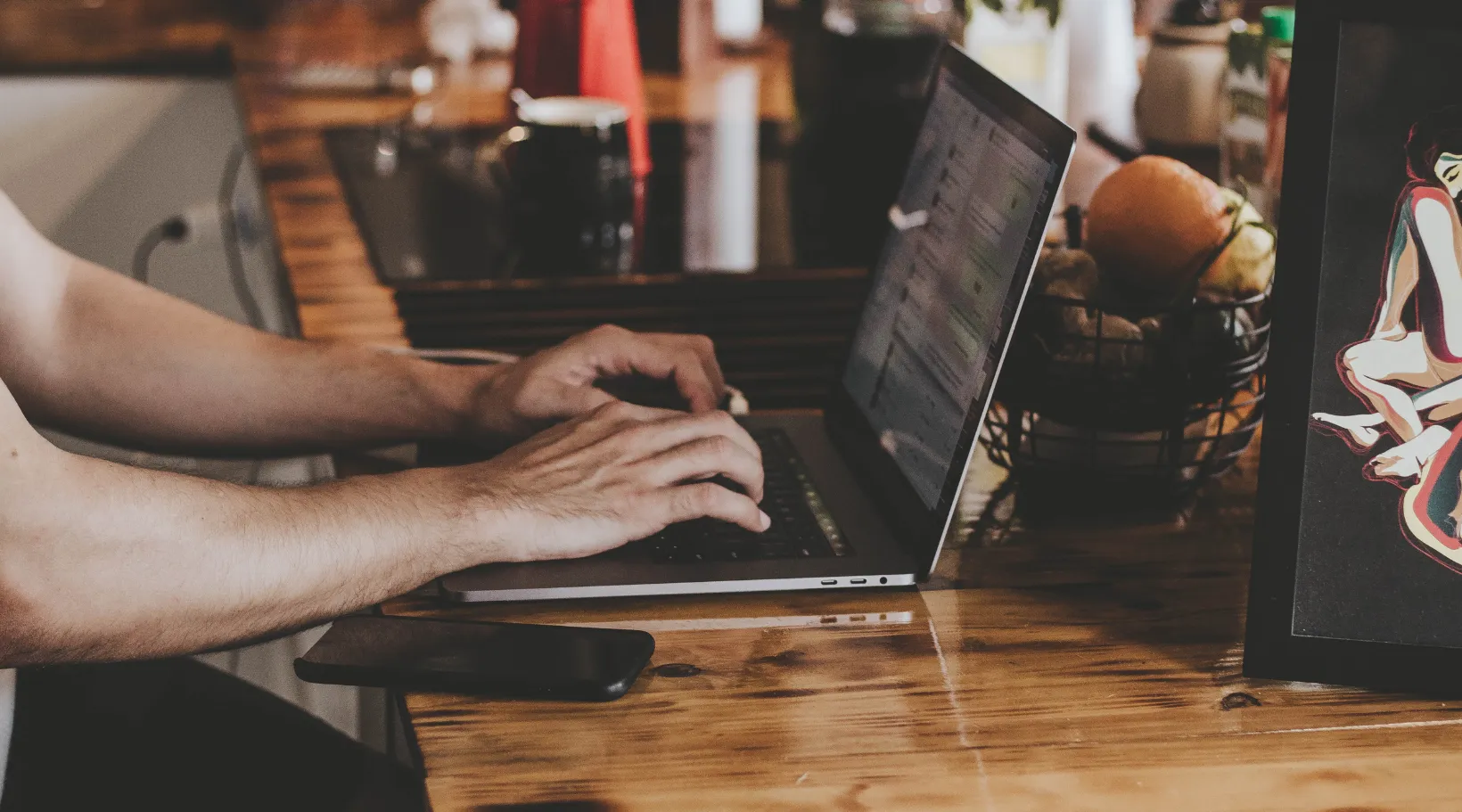 Remote worker using ShiftCare software on laptop to manage care tasks efficiently.