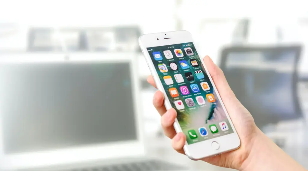 Smartphone displaying mobile interface representing ShiftCare app for caregiver scheduling and care updates.