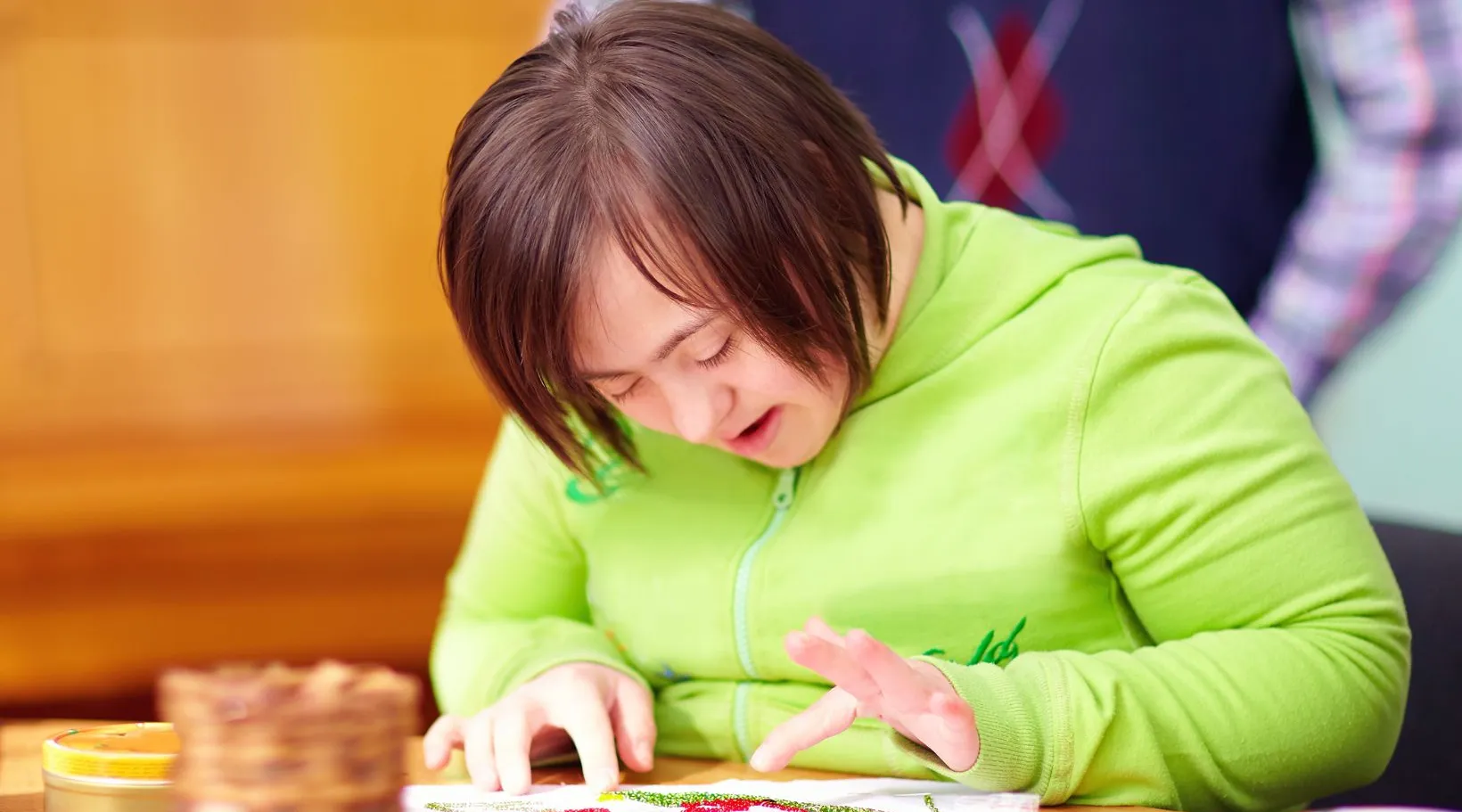 Art activity session with young woman with disability, ShiftCare.
