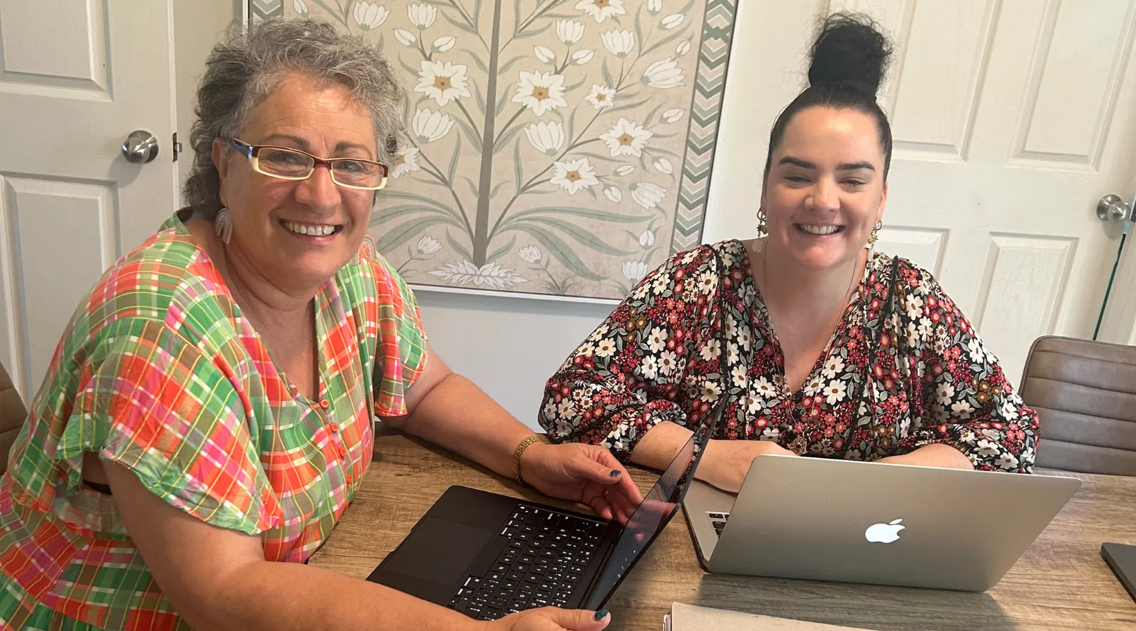 Care provider and team member using ShiftCare software to streamline NDIS coordination.