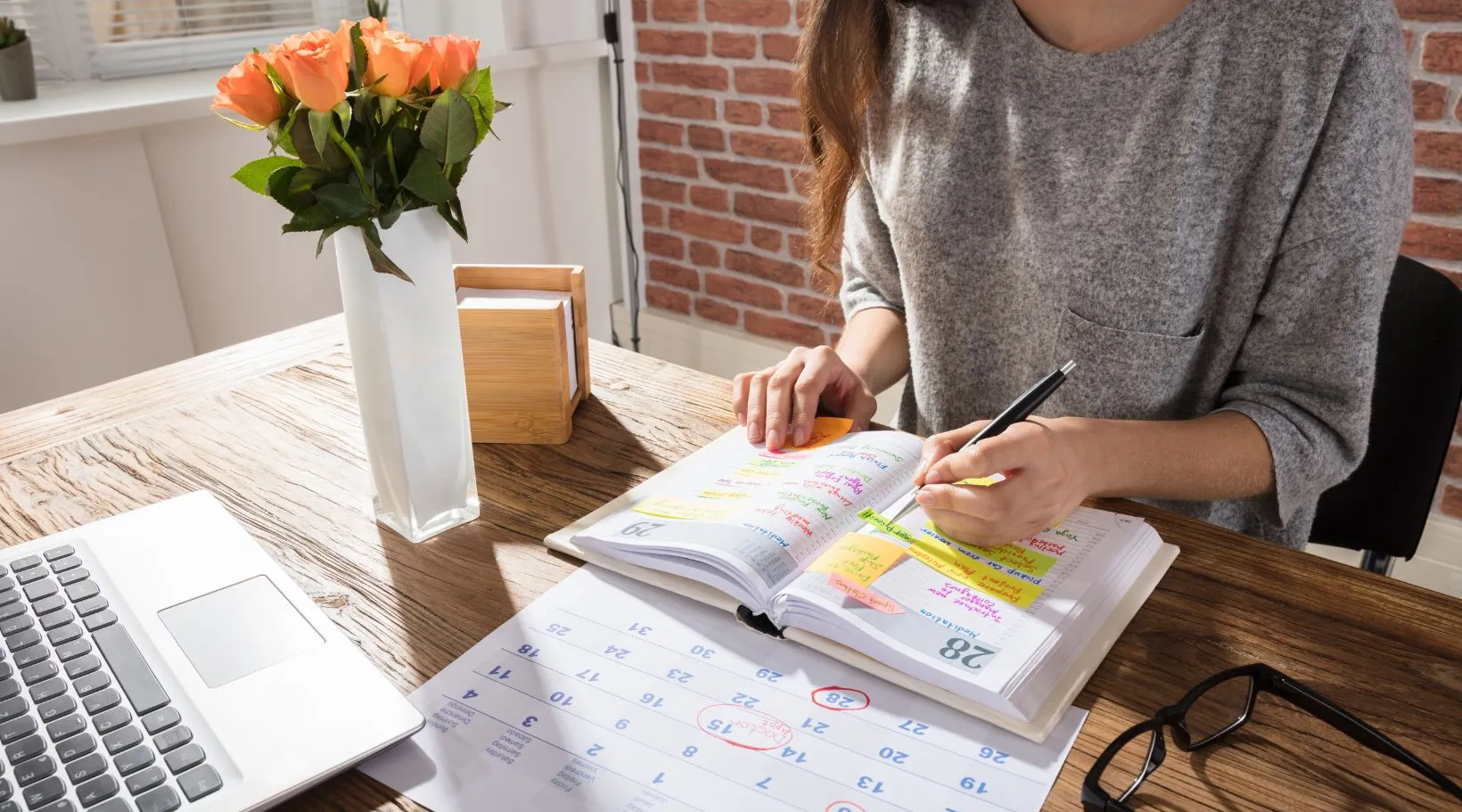 ShiftCare team member scheduling client care visits and tasks using digital calendar planner.