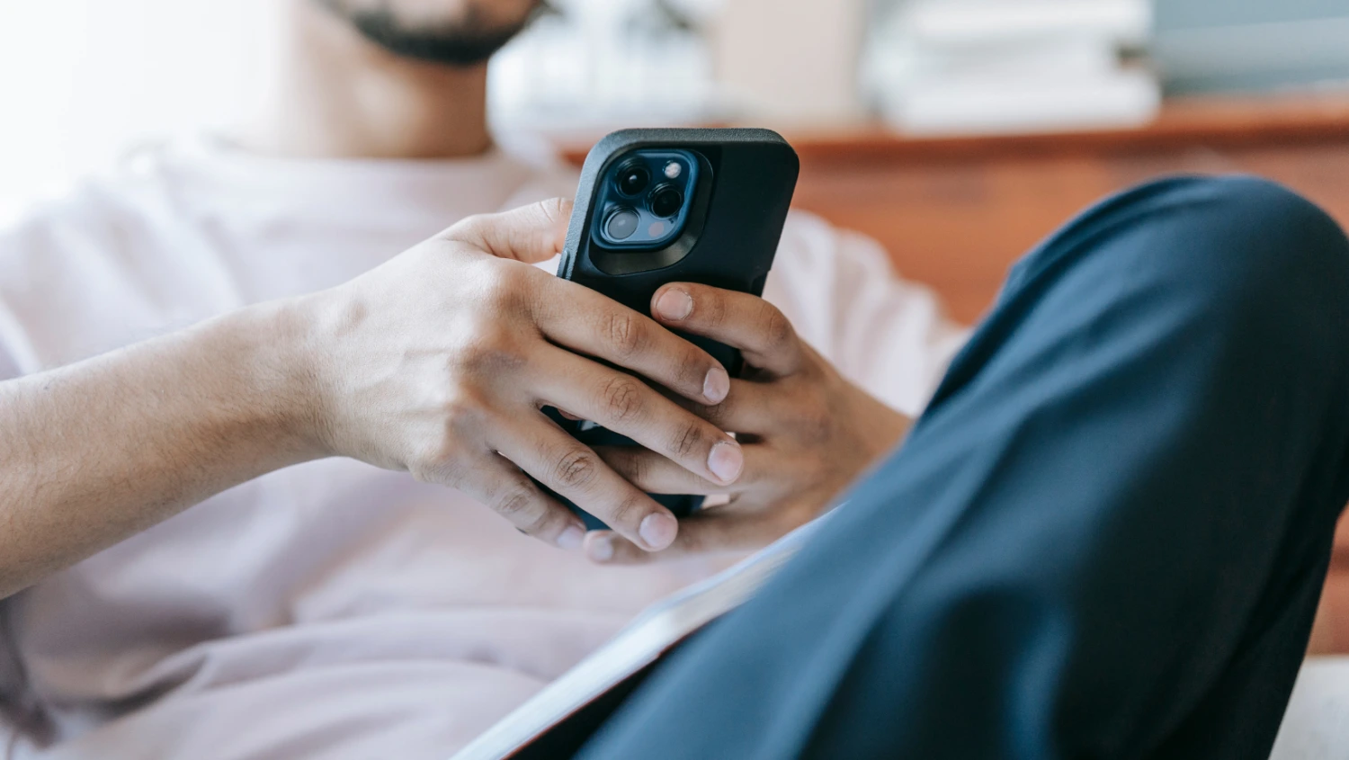 Support staff reviews care notifications on mobile using ShiftCare app.