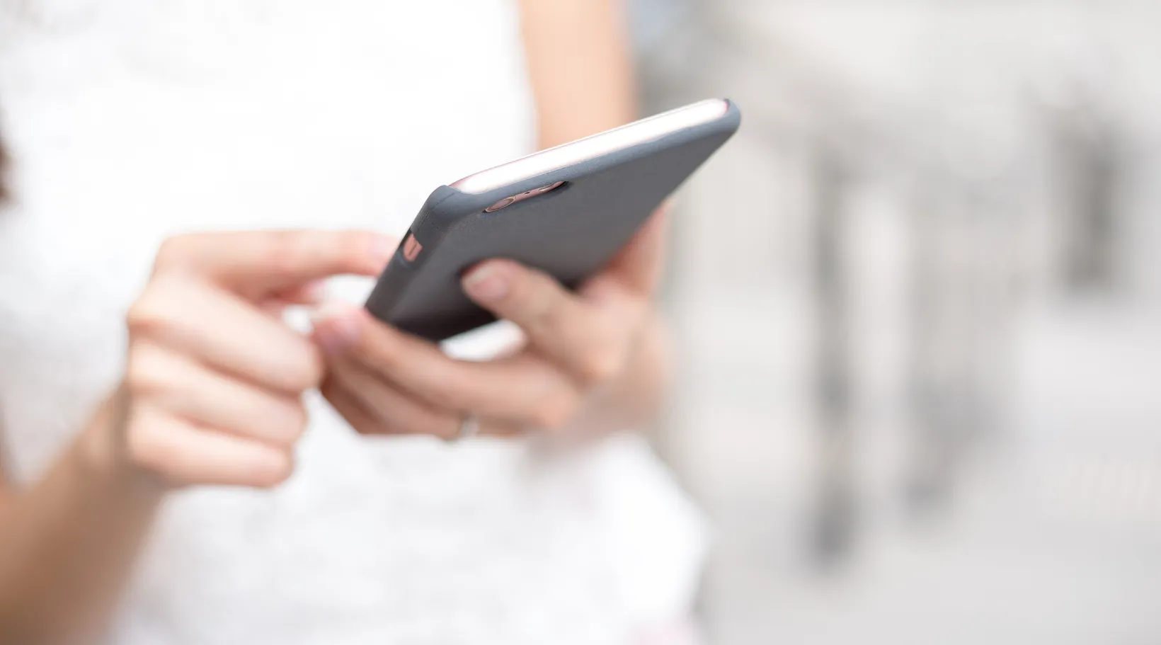 Care provider using the ShiftCare mobile app to manage shifts and communicate updates.