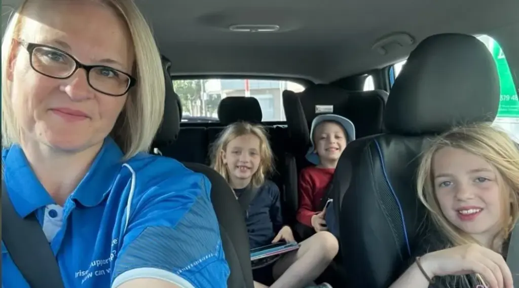 NDIS community support: carer transporting children to event, ShiftCare.