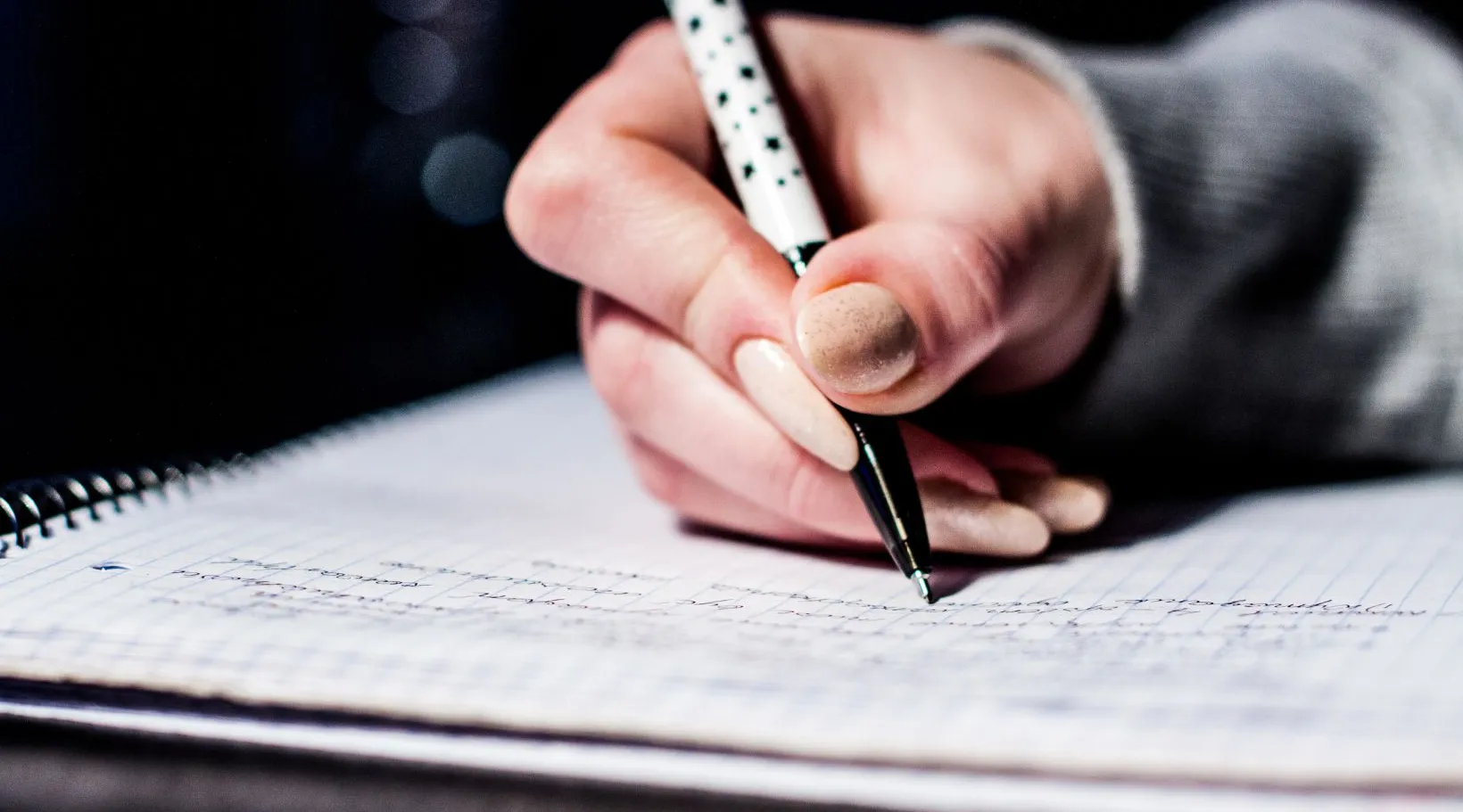 Care administrator writing notes and documenting client records in workflows supported by ShiftCare.