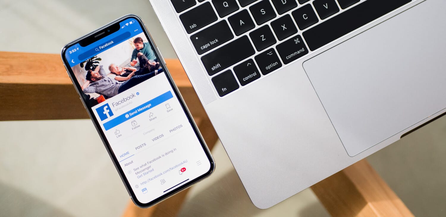 Online engagement concept with ShiftCare Facebook page on mobile.