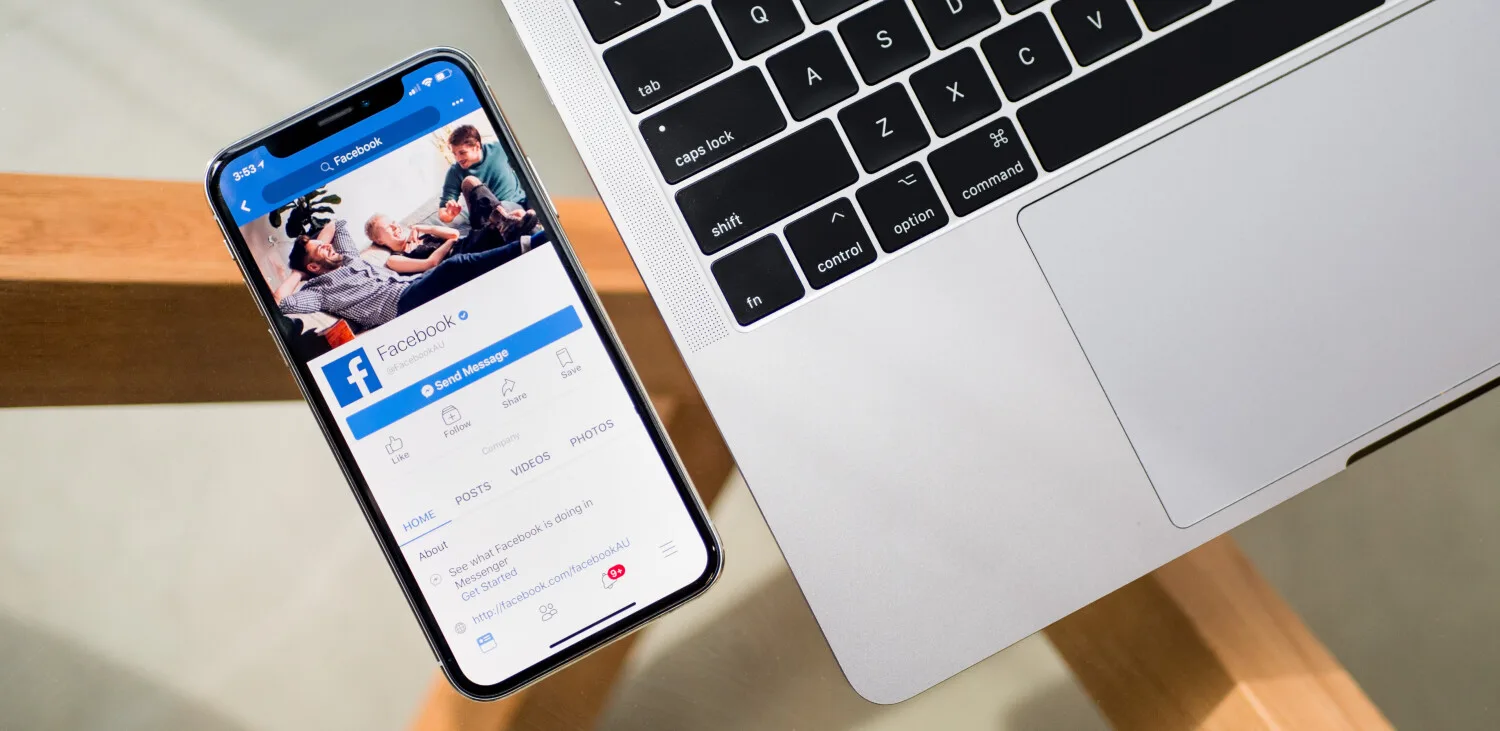 Online engagement concept with ShiftCare Facebook page on mobile.