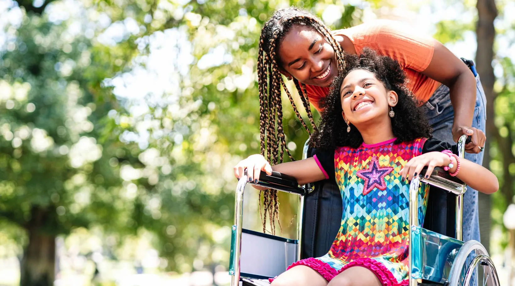 NDIS care provider engaging child in outdoor wellbeing activity, ShiftCare.