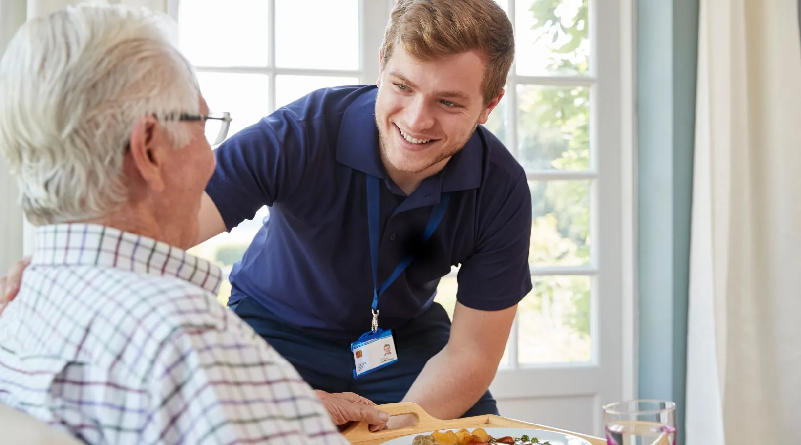 ShiftCare support worker providing meal and social assistance