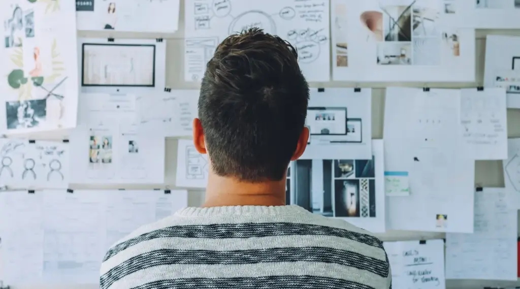 Business professional analyzing charts and workflow strategy, ShiftCare.