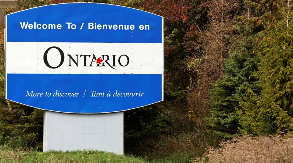Ontario welcome sign with bilingual text ‘More to Discover,’ ShiftCare.