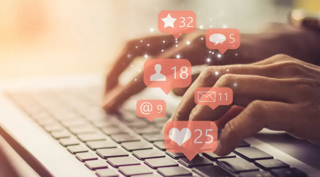 ShiftCare marketer engaging with social media notifications to boost referrals and brand reach.