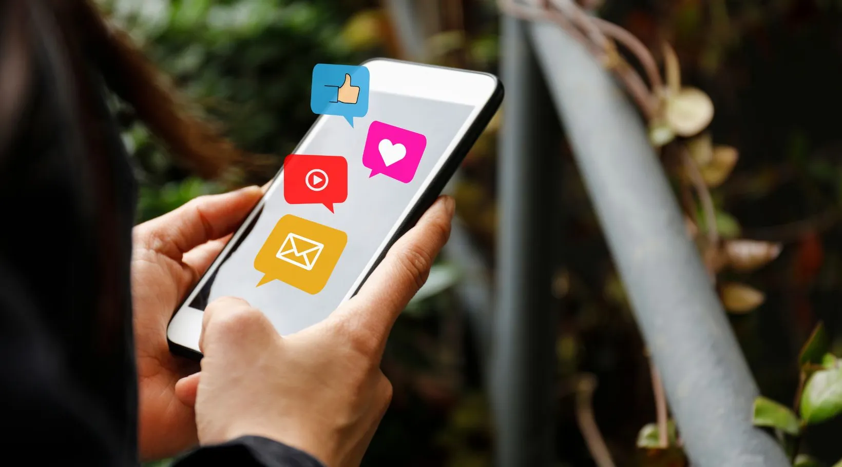 Person checking social media notifications on mobile device, ShiftCare.