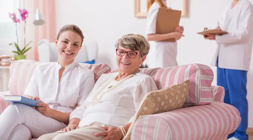 Caregiver using ShiftCare to support senior client with personalized home care and wellbeing.