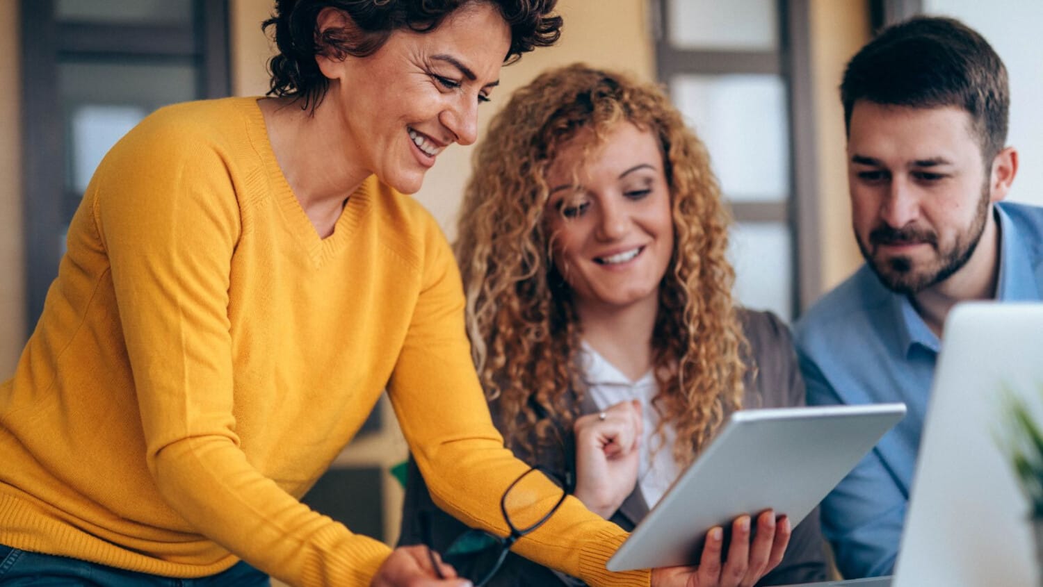 Care team using technology to enhance disability support delivery and participant outcomes.