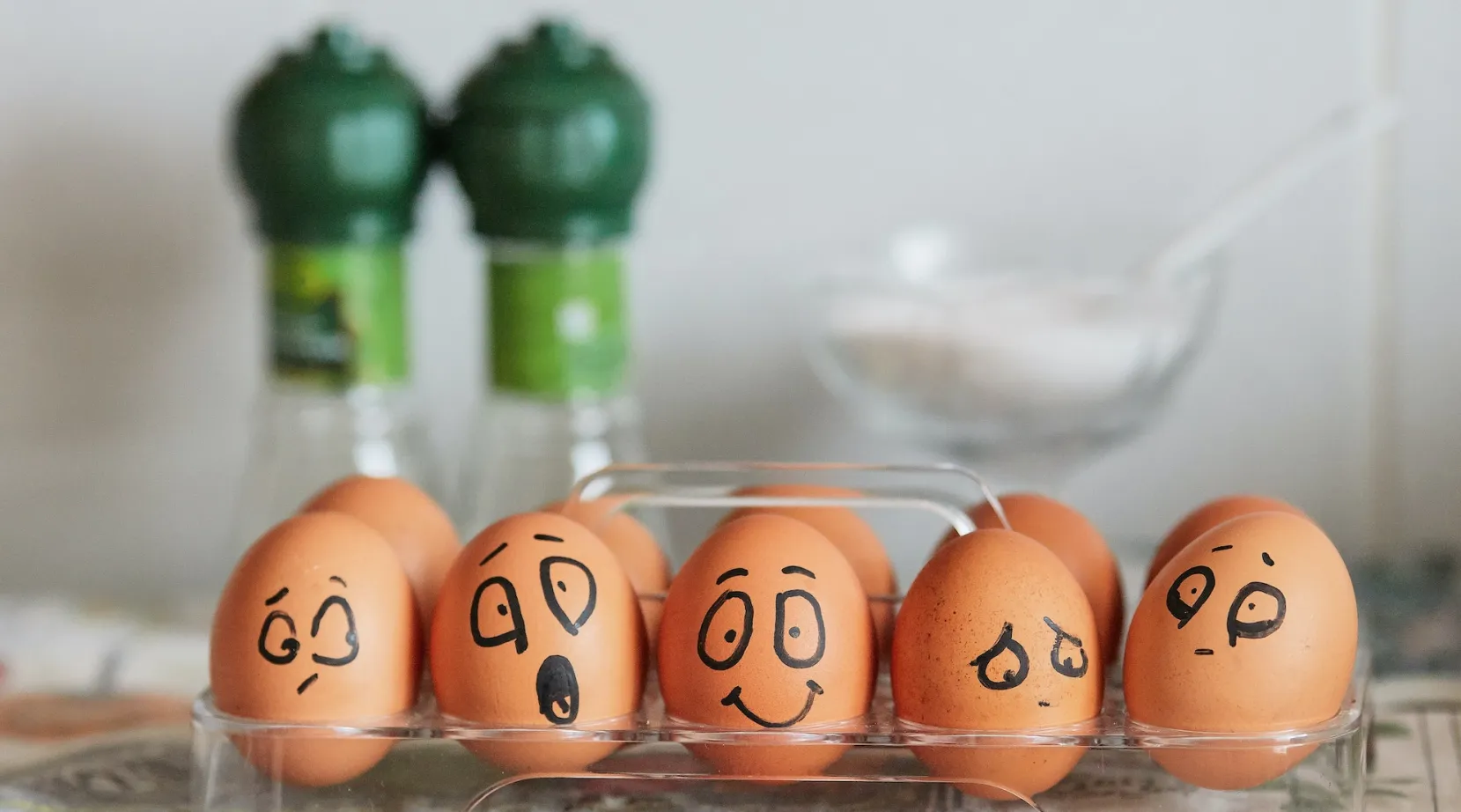 Eggs with hand-drawn faces showing different emotions, used in ShiftCare wellbeing content.