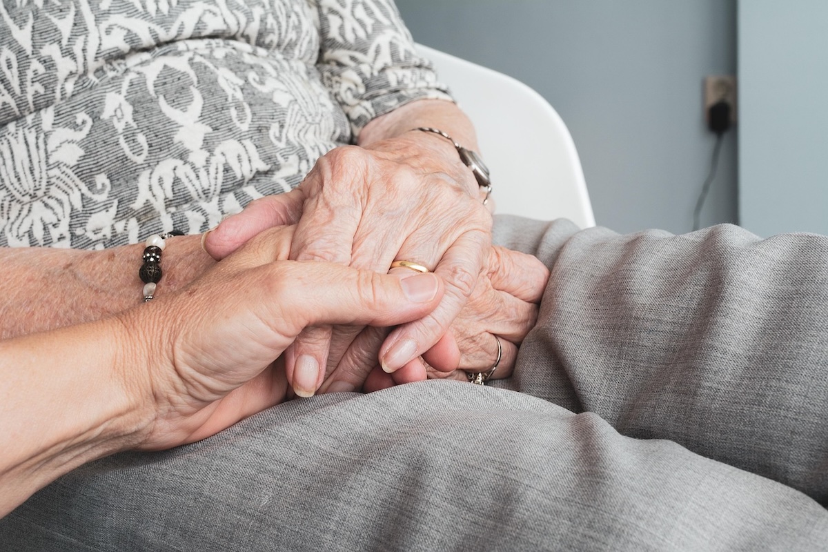 Folded hands of a senior patient