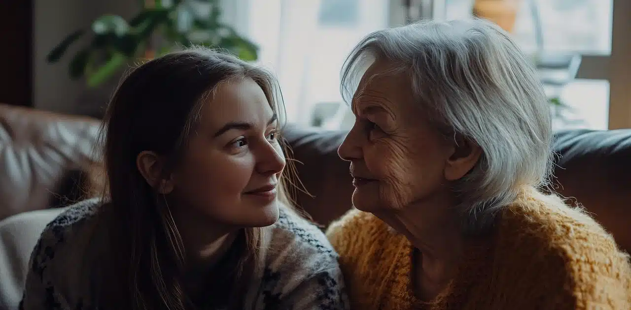 An older woman and a young woman looking at each other