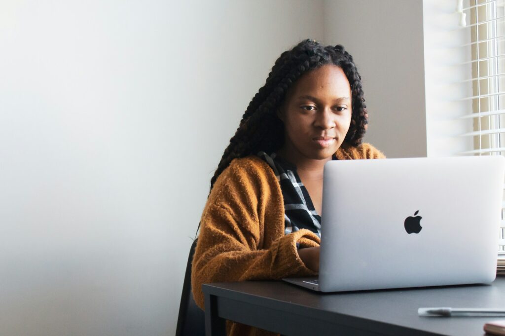 Female carer using mac laptop for work