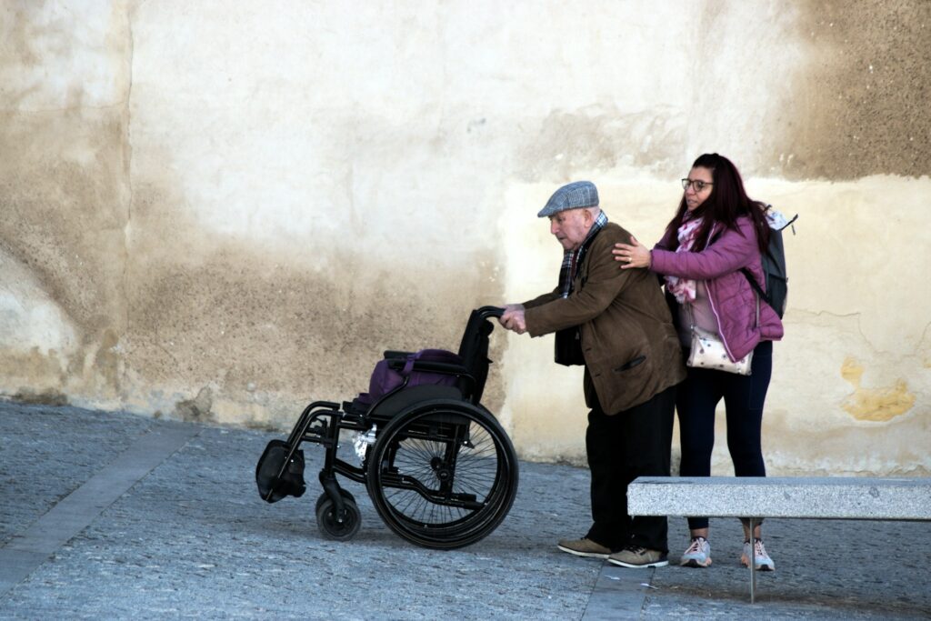 Carer helping a senior with their wheelchair