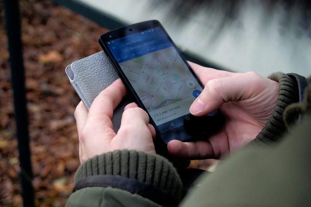 Carer using navigation map on phone