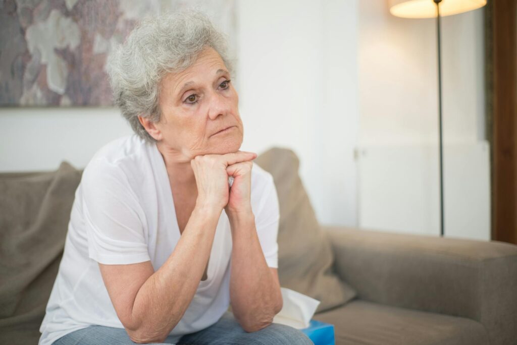 Senior woman sitting on the sofa