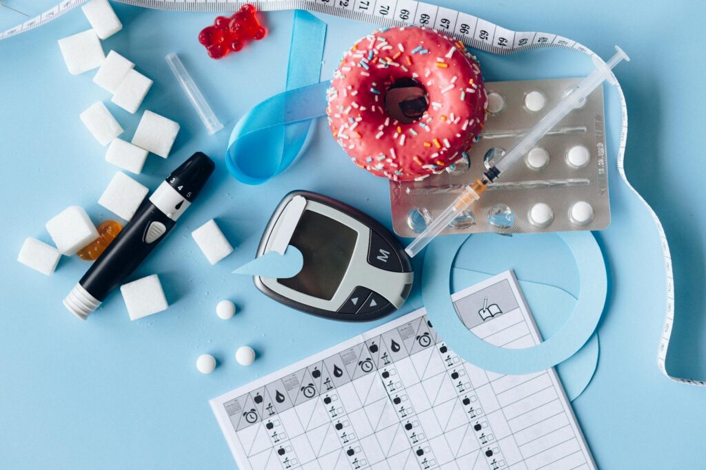 Medicine, pills, and syringe next to calendar