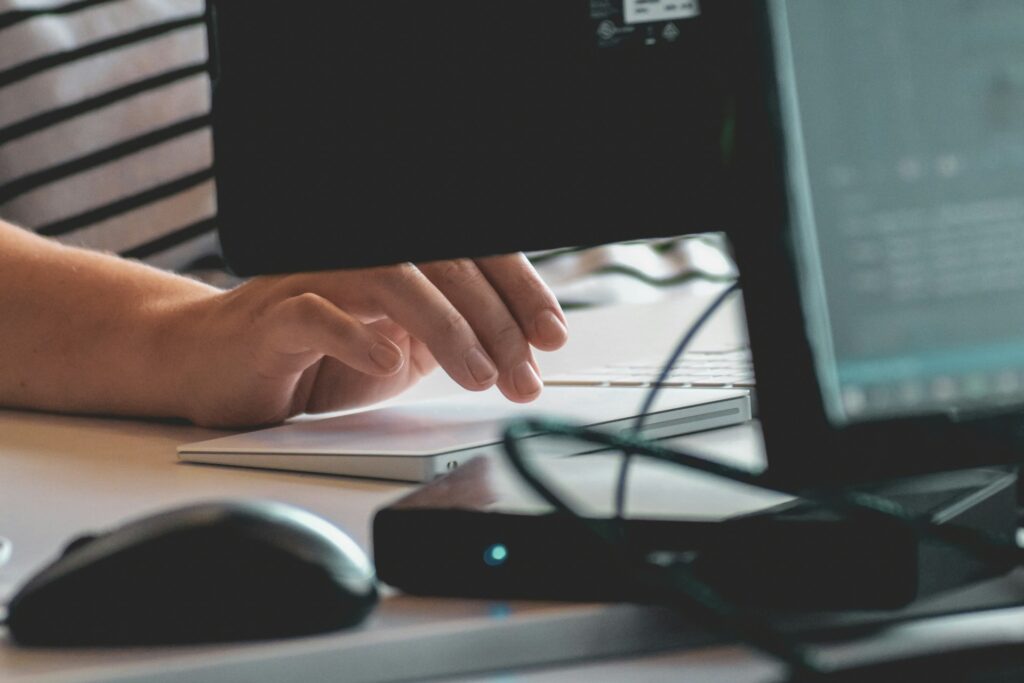 Hands of a person using a computer
