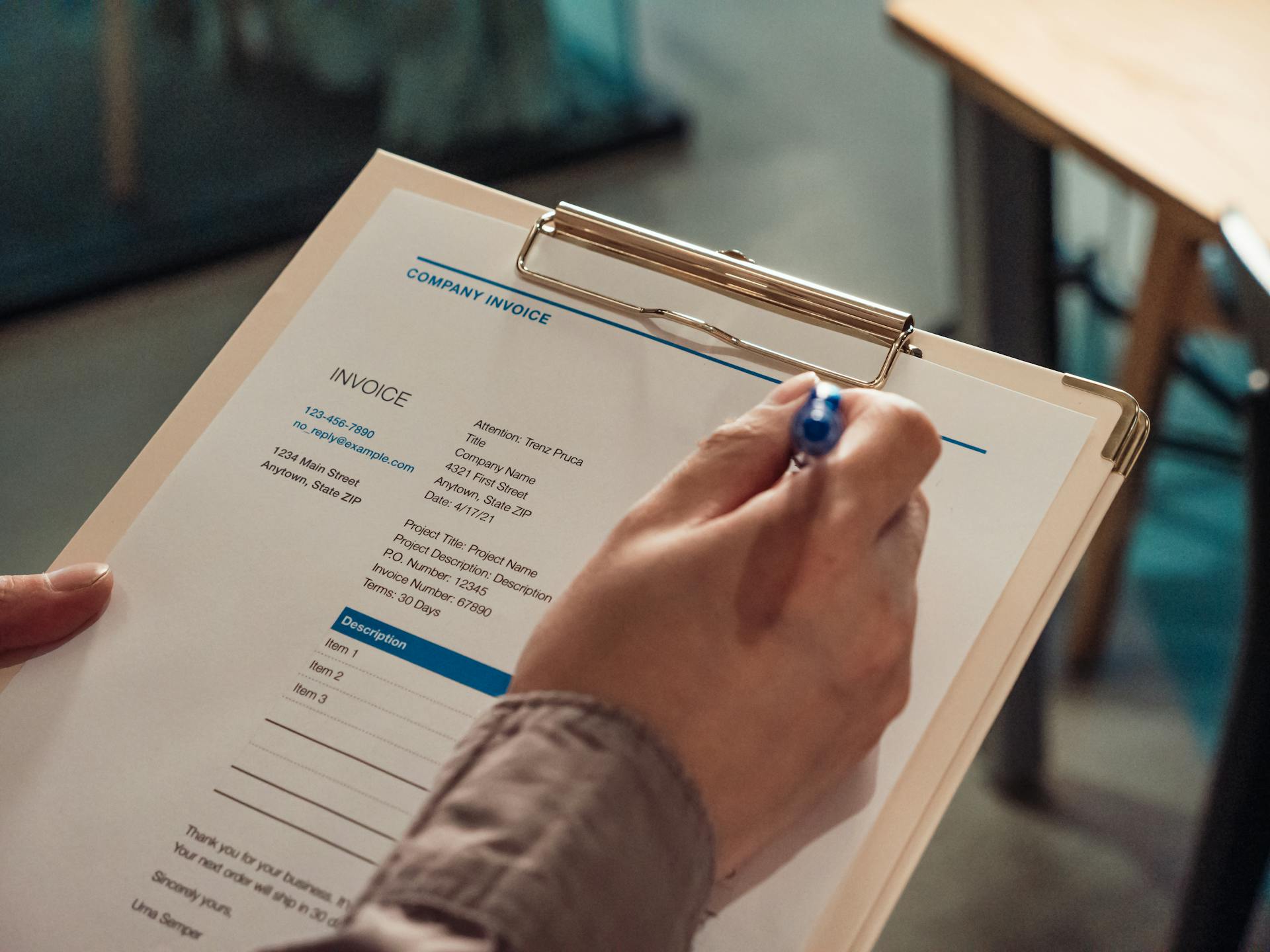 Care worker completing a client assessment form on clipboard for care documentation