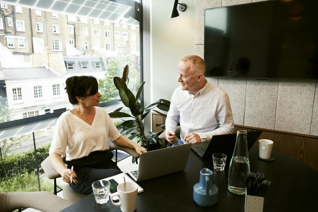 Two people talking in a private room