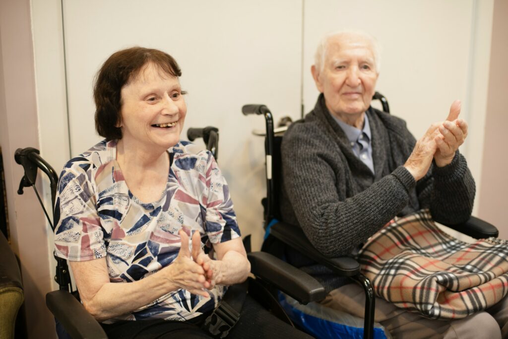 Two seniors in wheelchairs