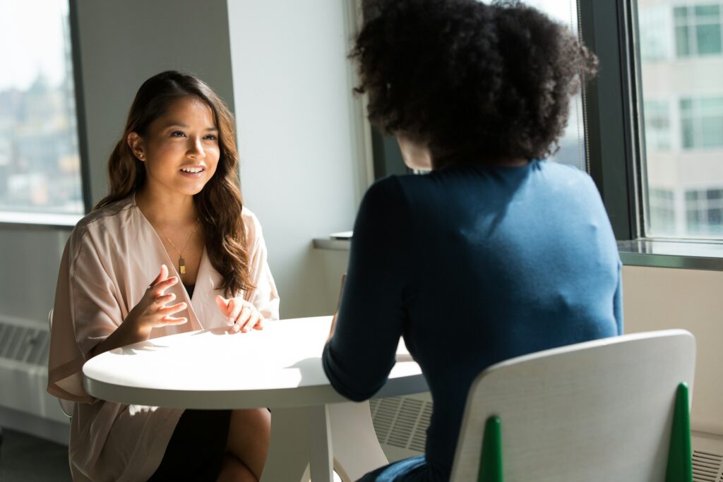 Woman interviewing another woman