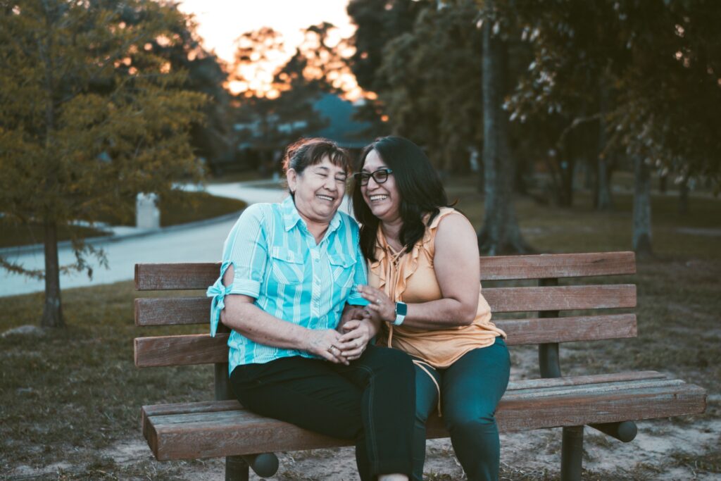 adult and caregiver hugging each other