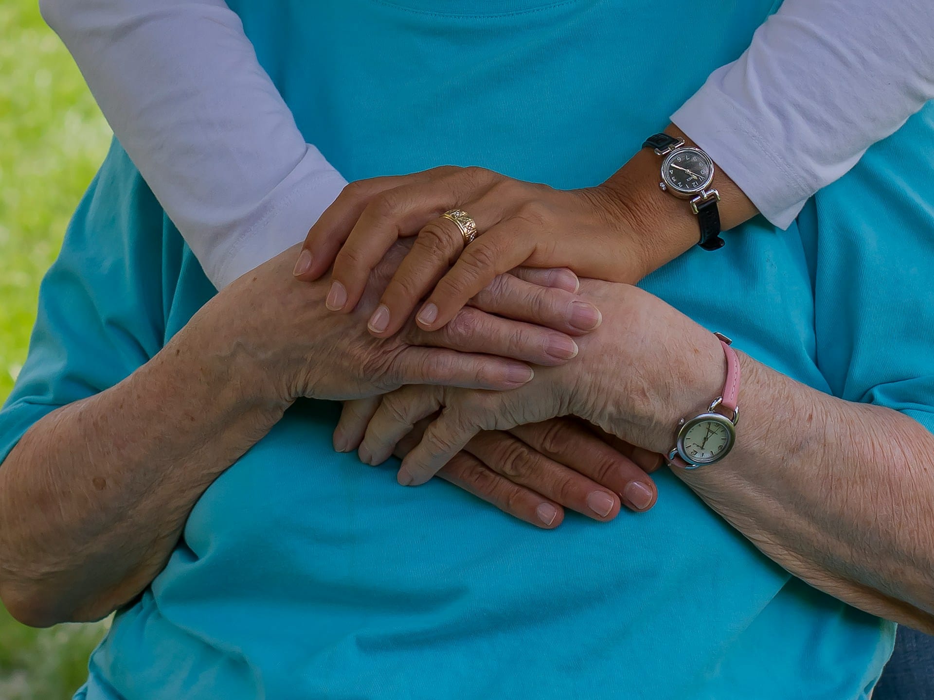 people's hands on top of each other