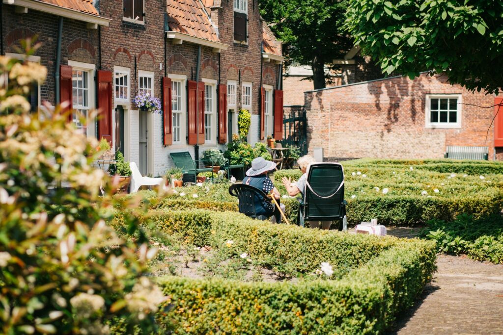 two seniors in a garden