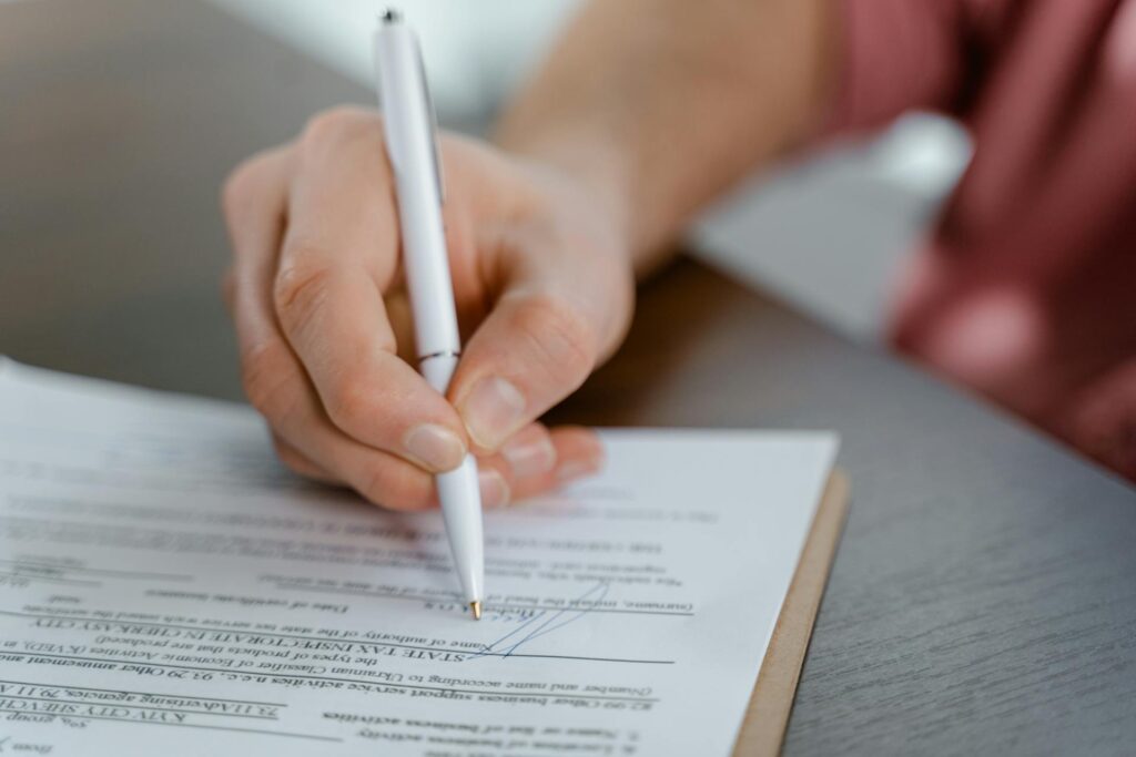 hand signing a document